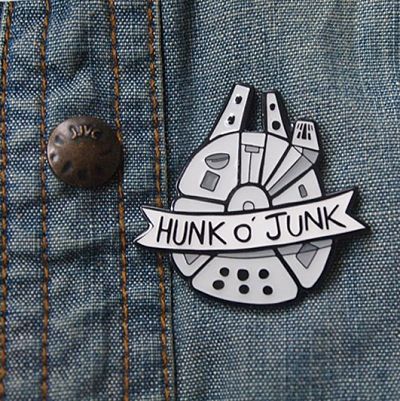 Millennium Falcon enamel pin with the text 'Hunk O' Junk'