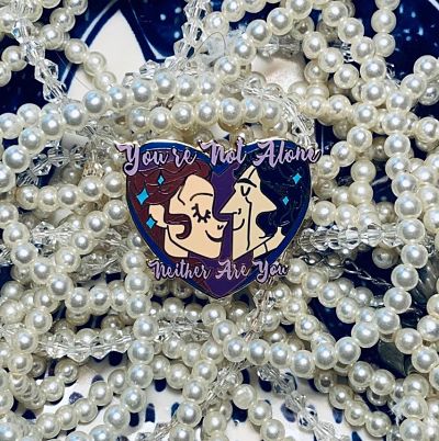 Rey and Kylo Ren heart-shaped enamel pin with the text 'You're Not Alone' and 'Neither Are You'