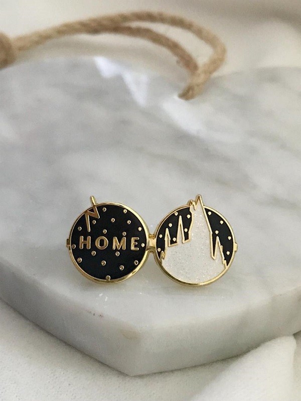 Harry Potter’s glasses with Hogwarts silhouette and the word home enamel pin