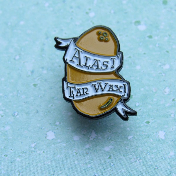 Alas! Ear wax! Every flavor bean enamel pin