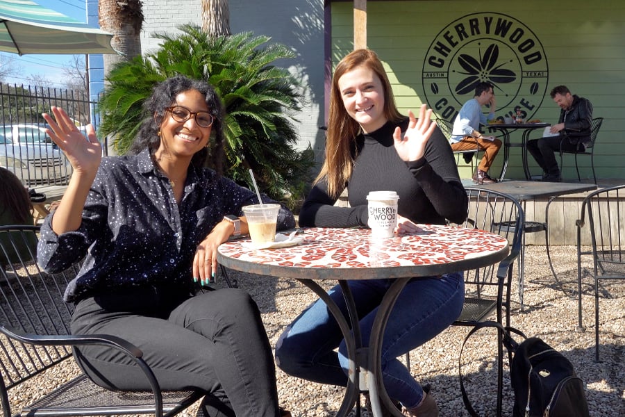 Protect America team members seated outside of Cherrywood Coffee Austin while searching for the best coffee in Austin